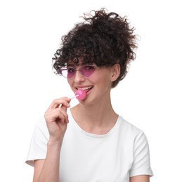 Beautiful woman in sunglasses with lollipop on white background