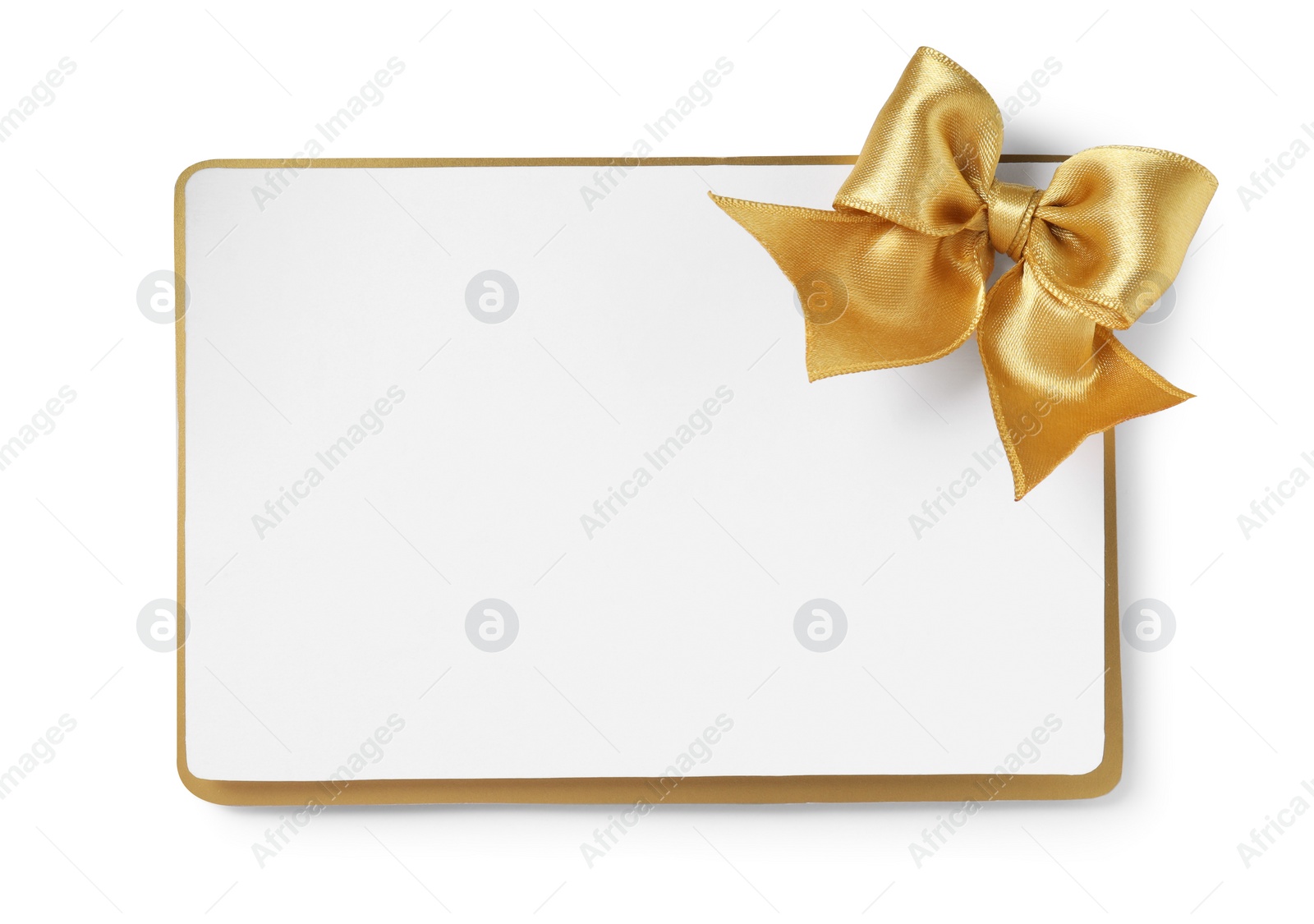 Photo of Blank gift card with golden bow isolated on white, top view