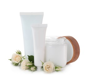 Different hand care cosmetic products and roses on white background