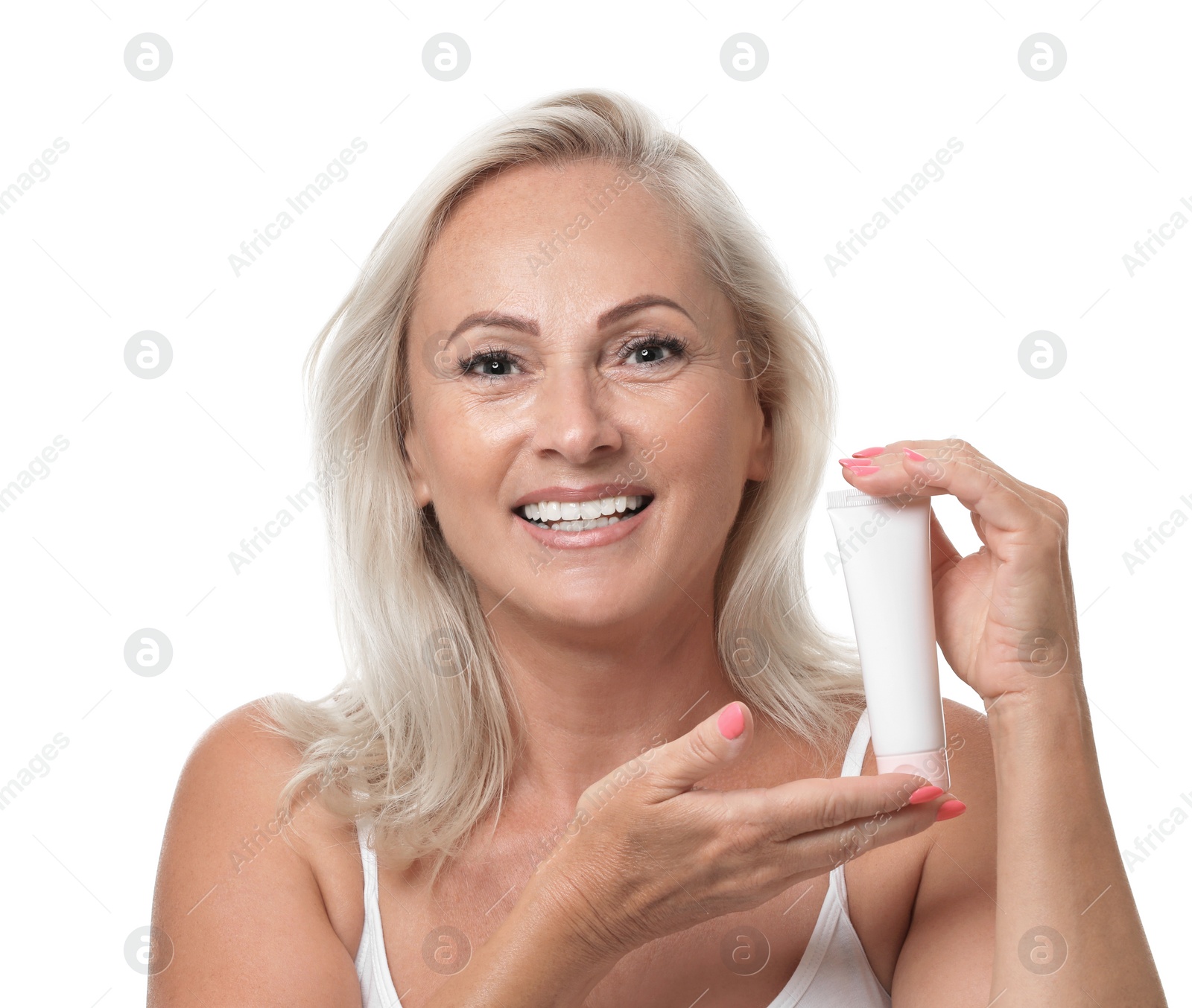 Photo of Portrait of beautiful mature woman with perfect skin holding tube of cream on white background