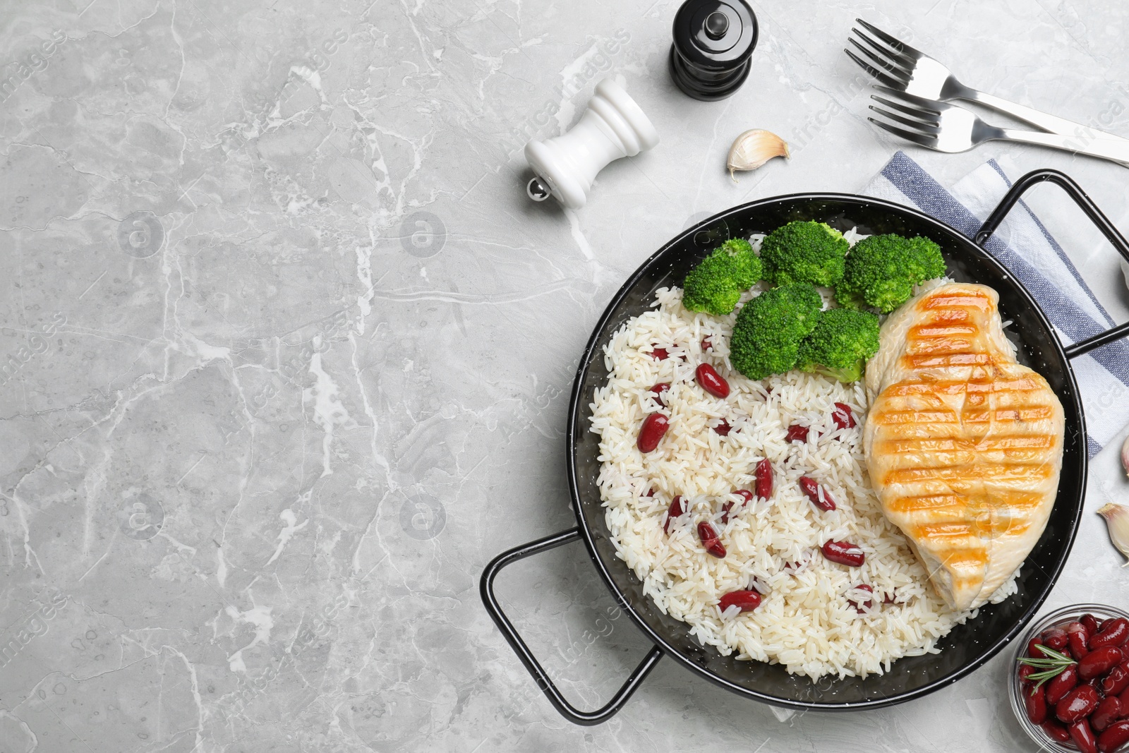 Photo of Tasty rice with beans served on light grey marble table, flat lay. Space for text