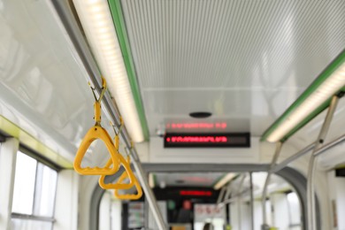Photo of Grab pole with handgrip handles in public transport