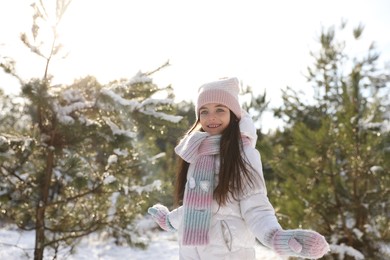 Photo of Cute little girl outdoors on winter day. Christmas vacation