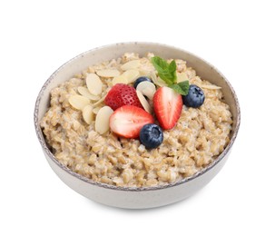 Photo of Tasty oatmeal with strawberries, blueberries and almond flakes in bowl isolated on white