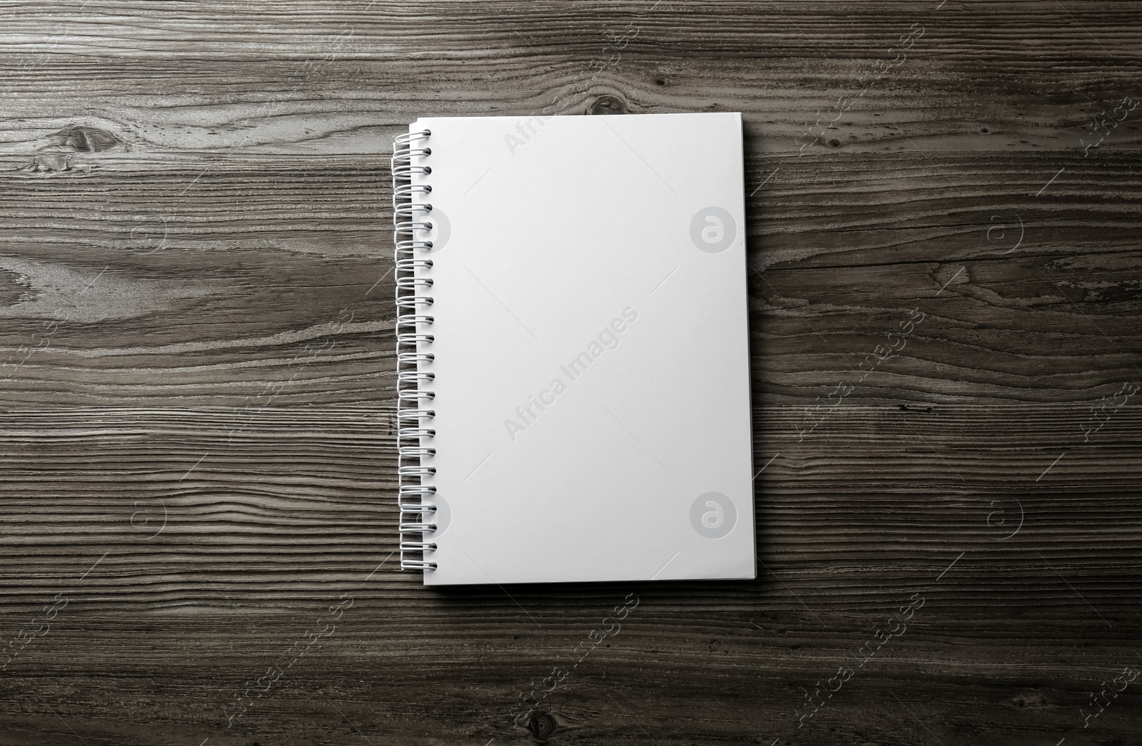 Photo of Blank paper brochure on wooden table, top view. Mockup for design