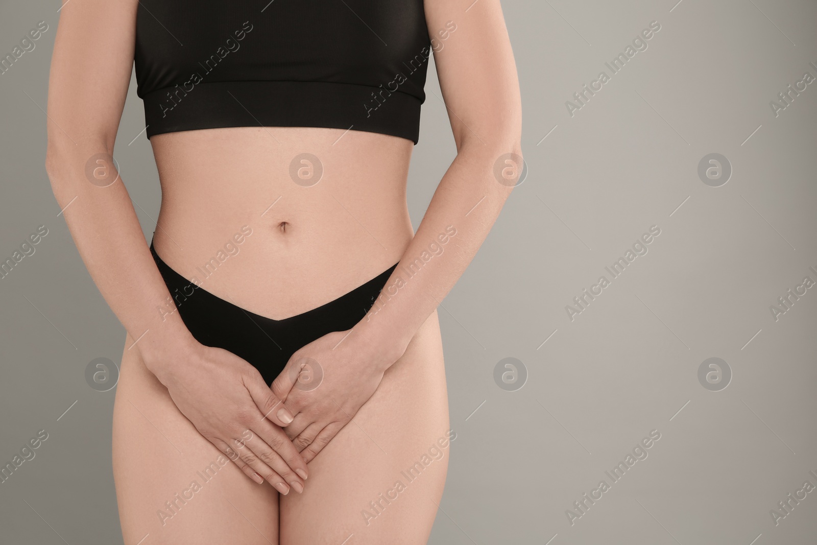 Photo of Gynecology. Woman in underwear on grey background, closeup. Space for text