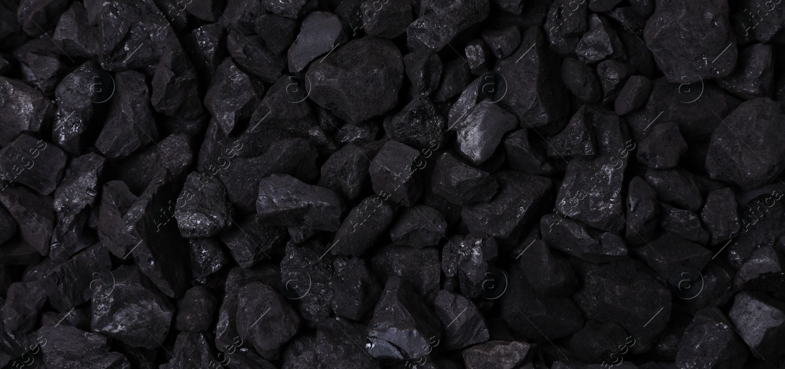 Photo of Pieces of black coal as background, top view