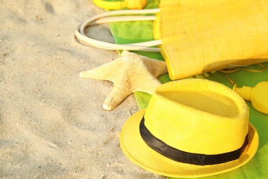 Photo of Composition with bright beach accessories on sand