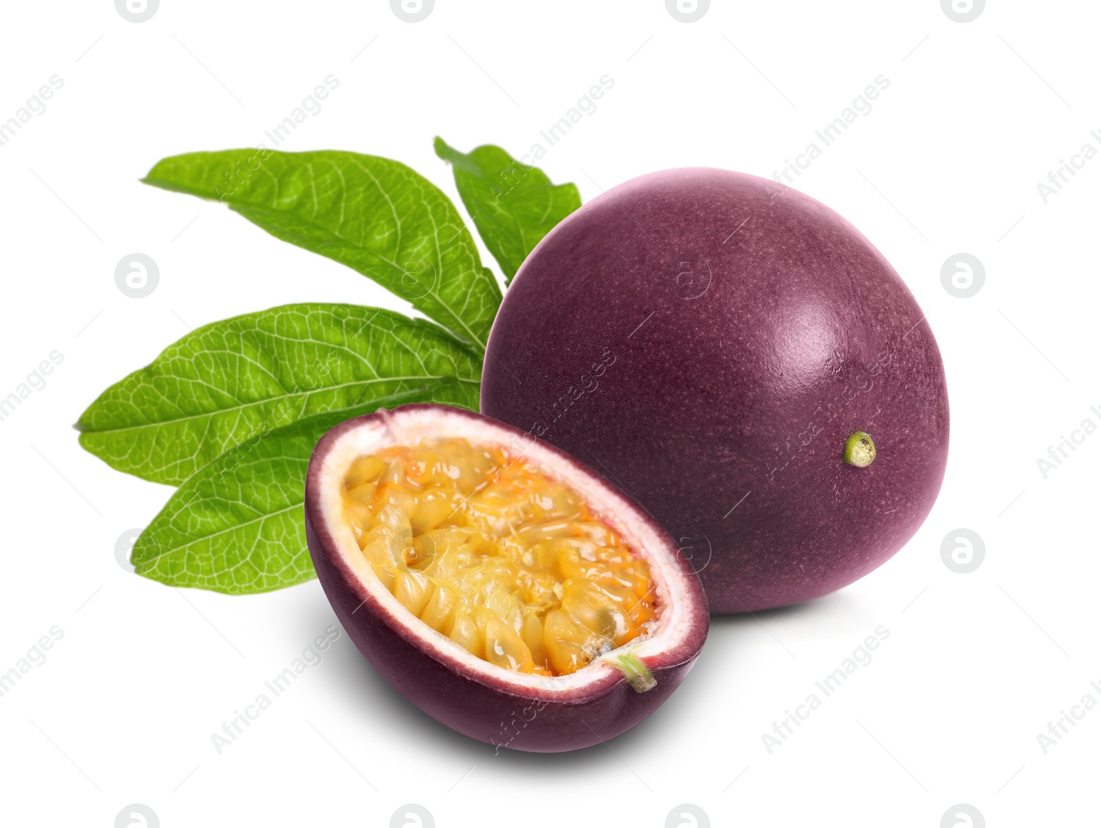 Image of Delicious ripe passion fruits and green leaves on white background