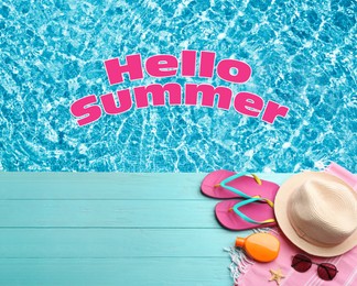 Image of Hello Summer. Beach accessories on light blue wooden deck near swimming pool, flat lay