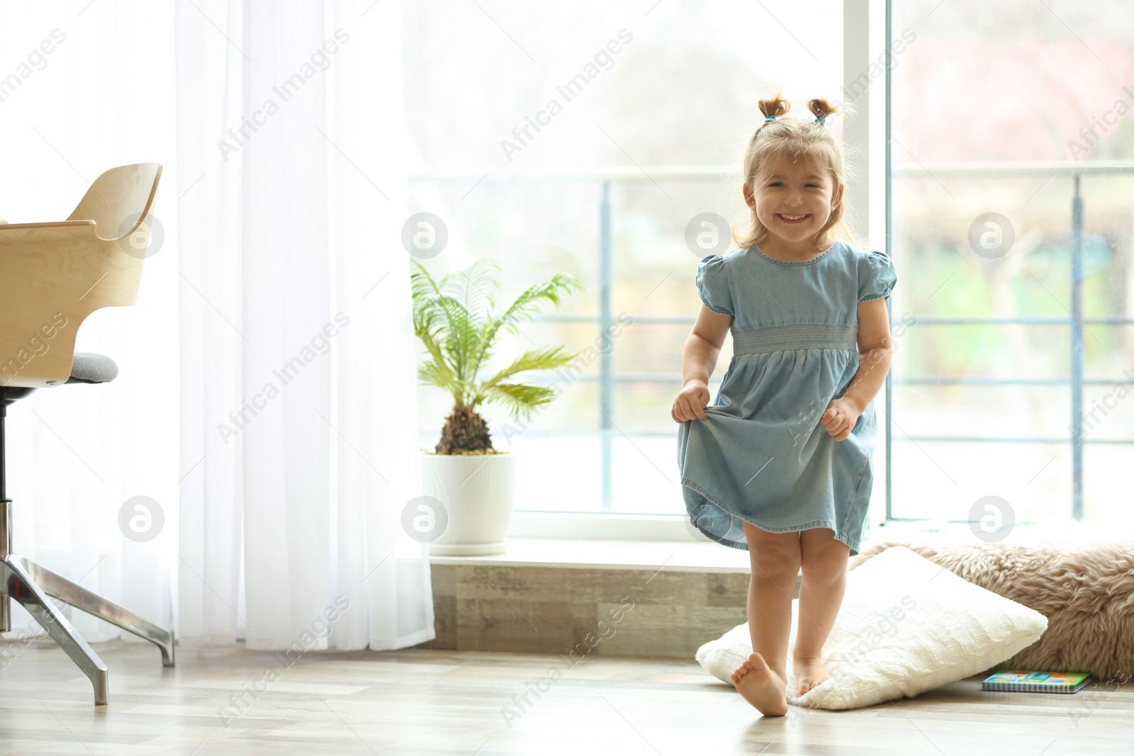 Photo of Cute little girl smiling at home