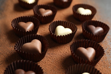 Beautiful heart shaped chocolate candies on table