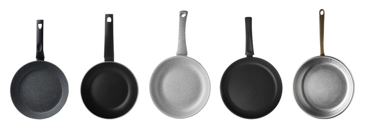 Image of Set with different frying pans on white background, top view. Banner design