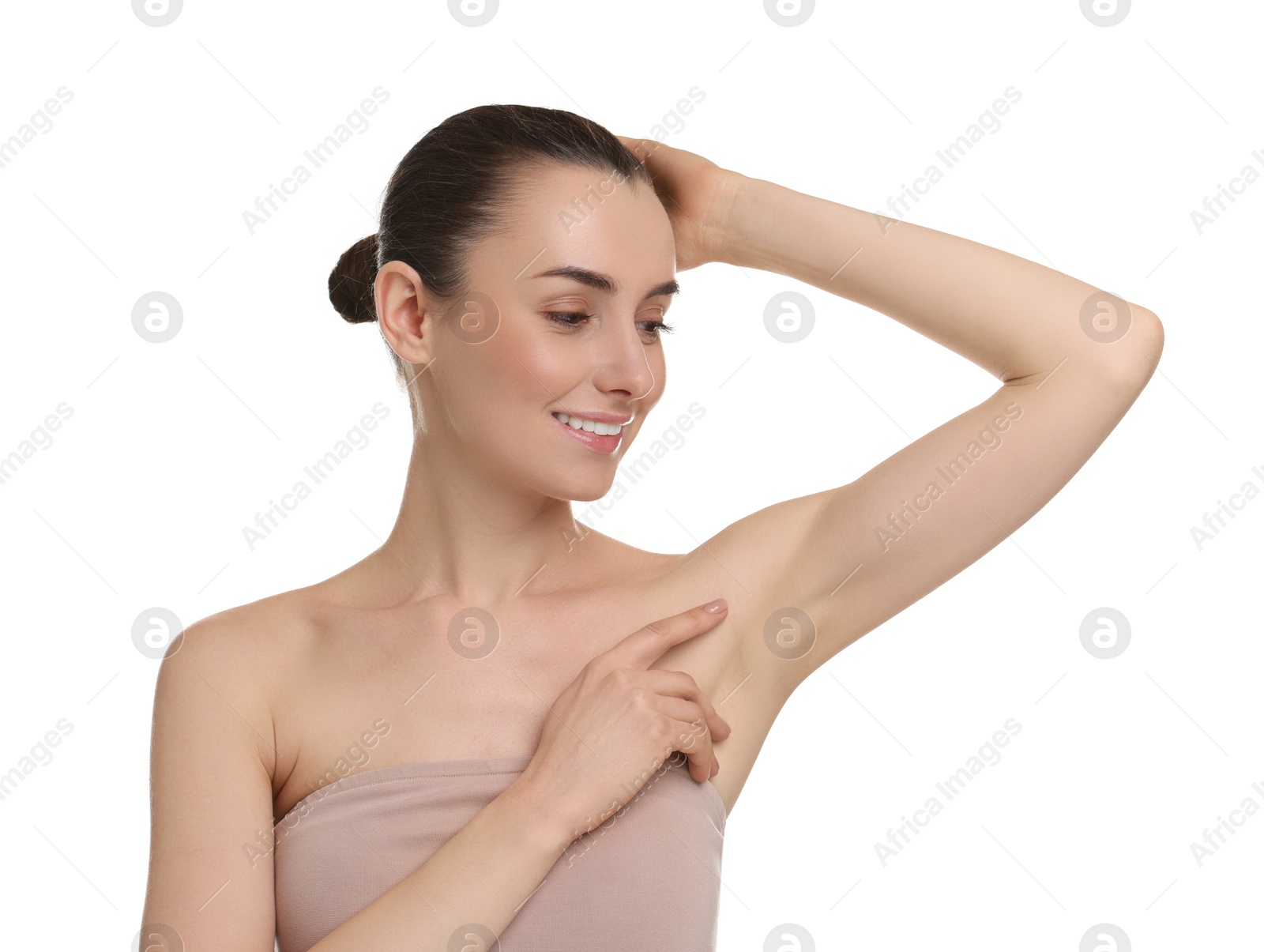 Photo of Beautiful woman showing armpit with smooth clean skin on white background