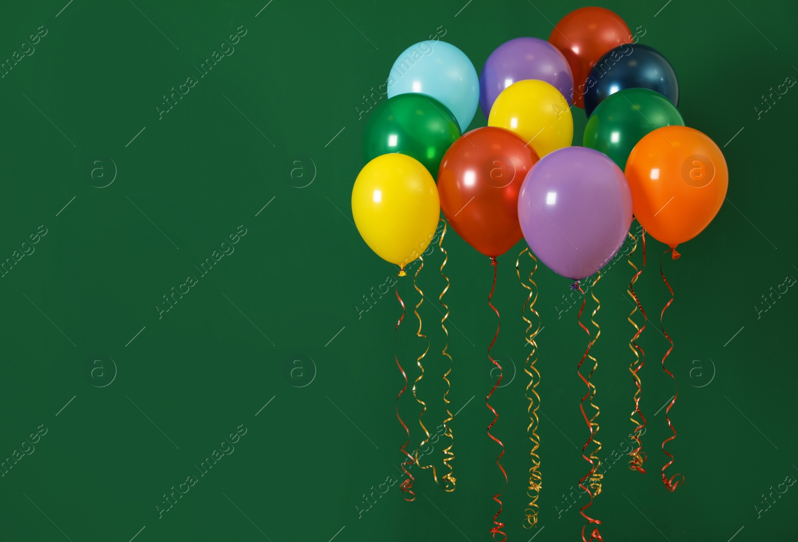 Photo of Bright balloons on color background, space for text. Celebration time