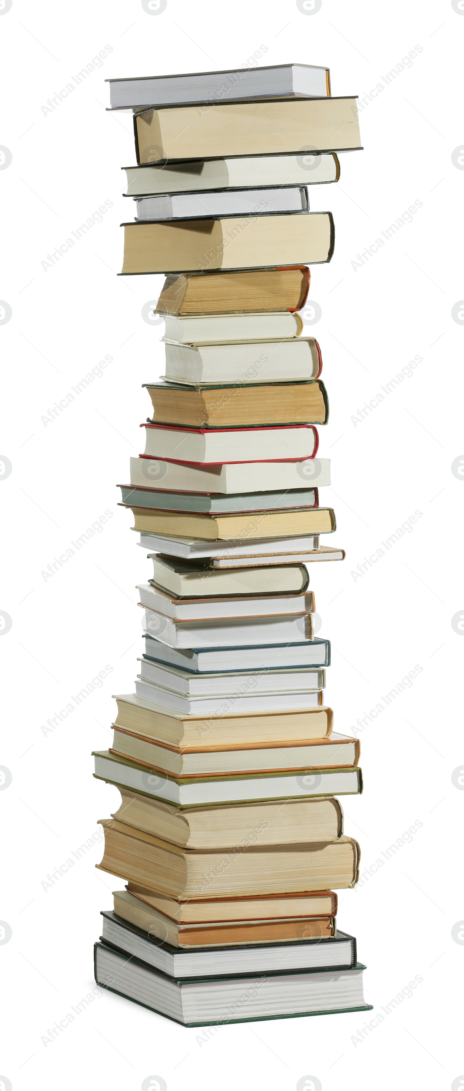 Photo of High stack of many different books isolated on white