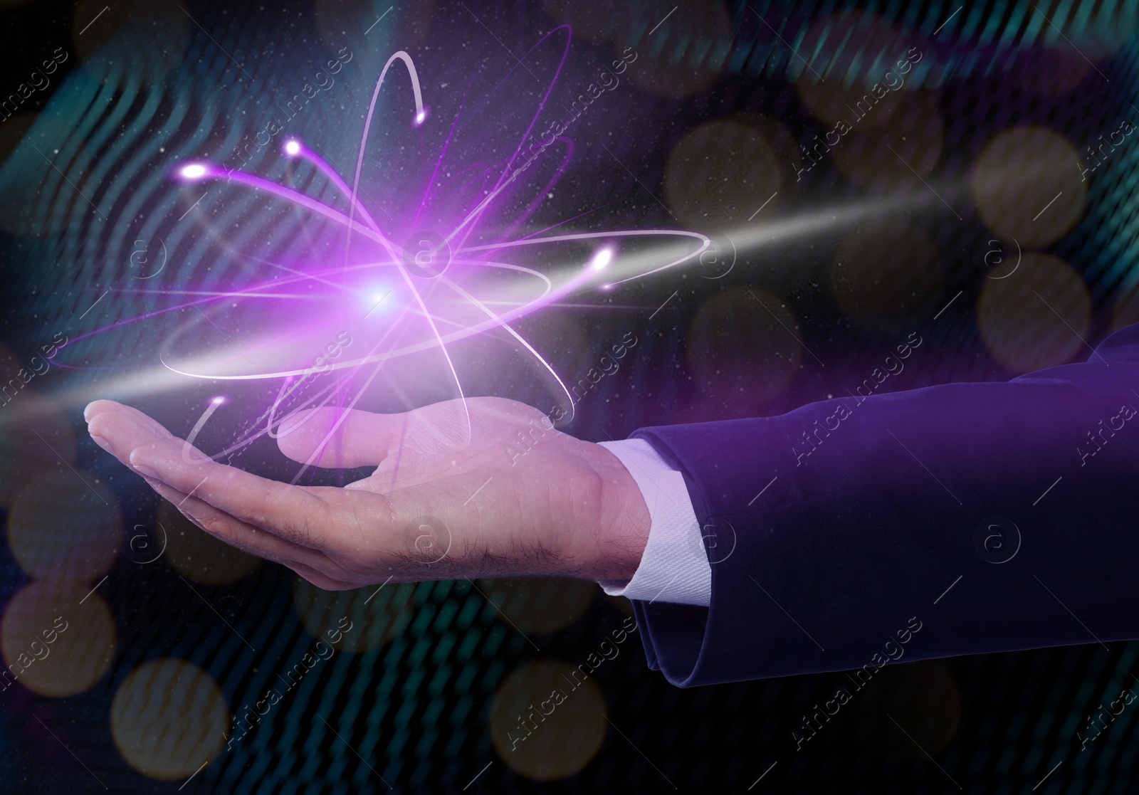 Image of Man holding virtual model of atom on color background, closeup