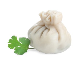 Photo of One tasty fresh khinkali (dumpling) and parsley isolated on white. Georgian cuisine