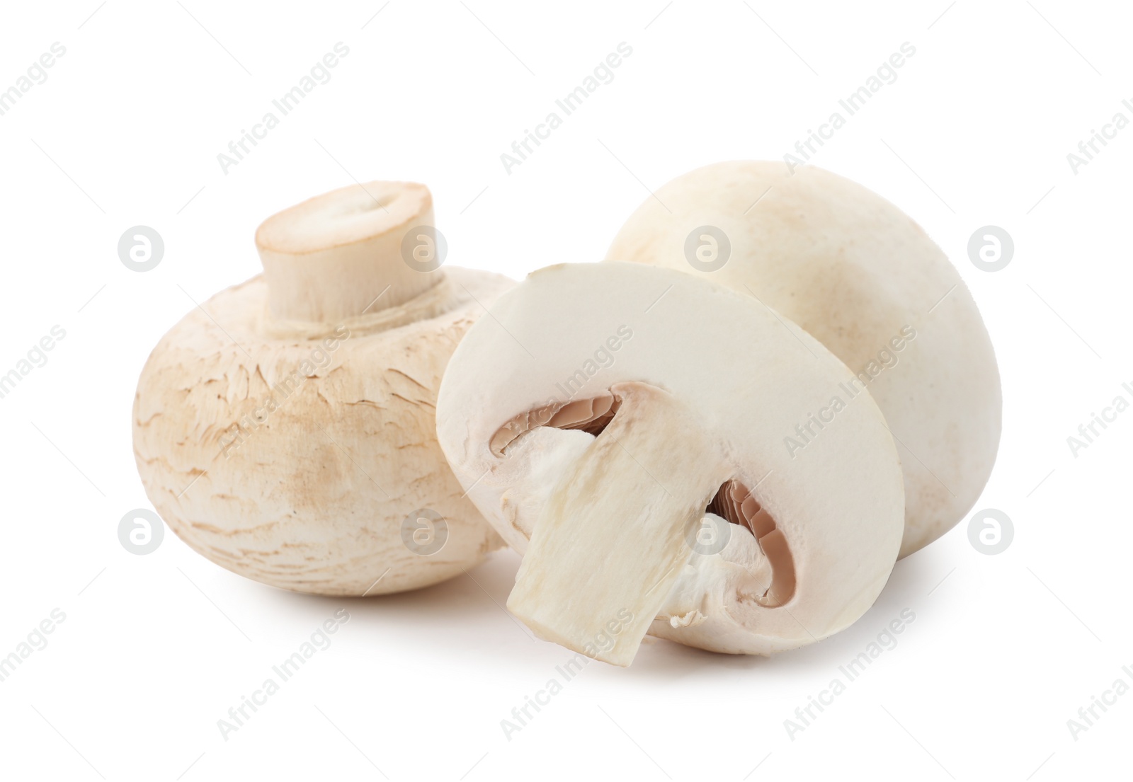 Photo of Fresh raw champignon mushrooms on white background