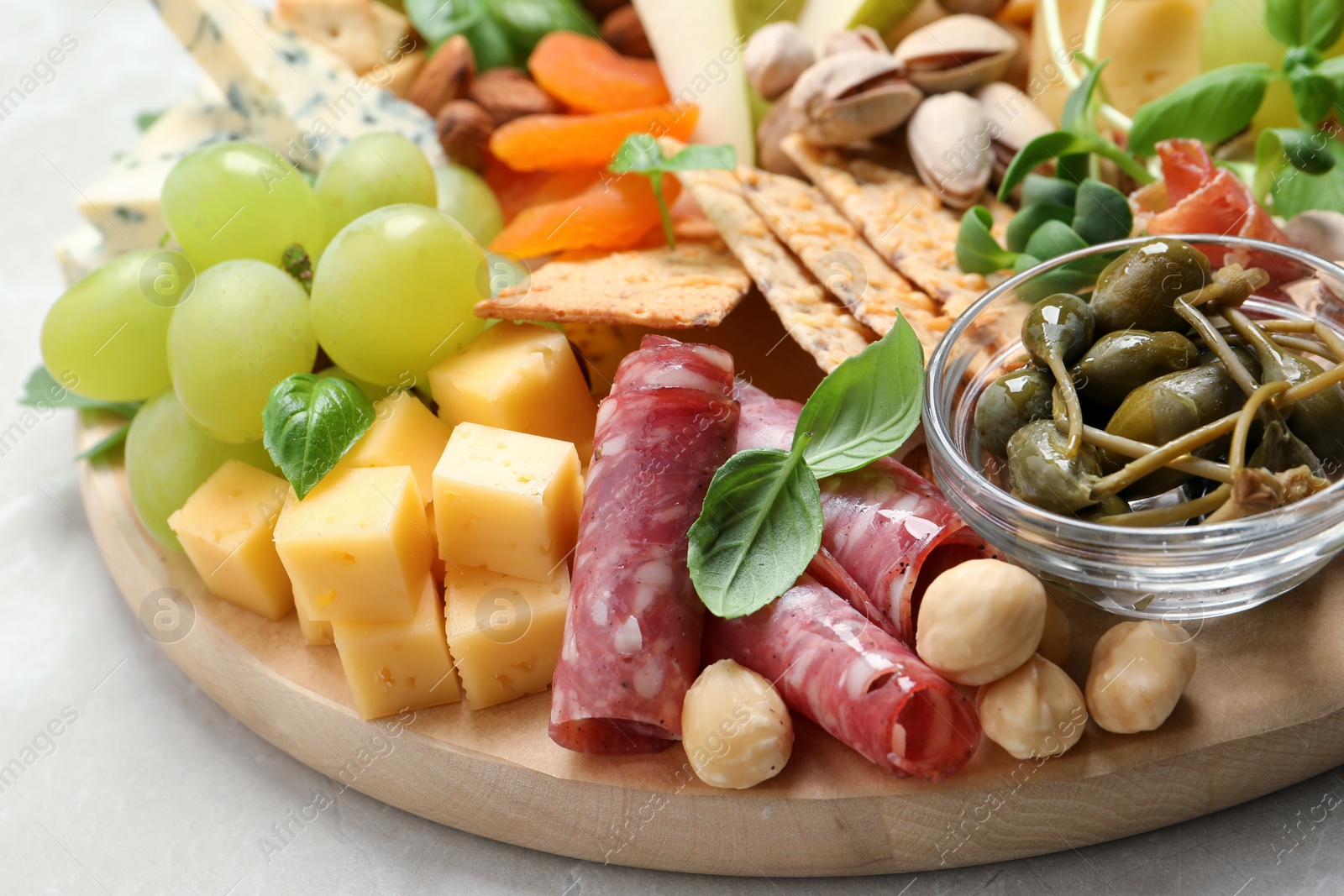 Photo of Different tasty appetizers on light table, closeup