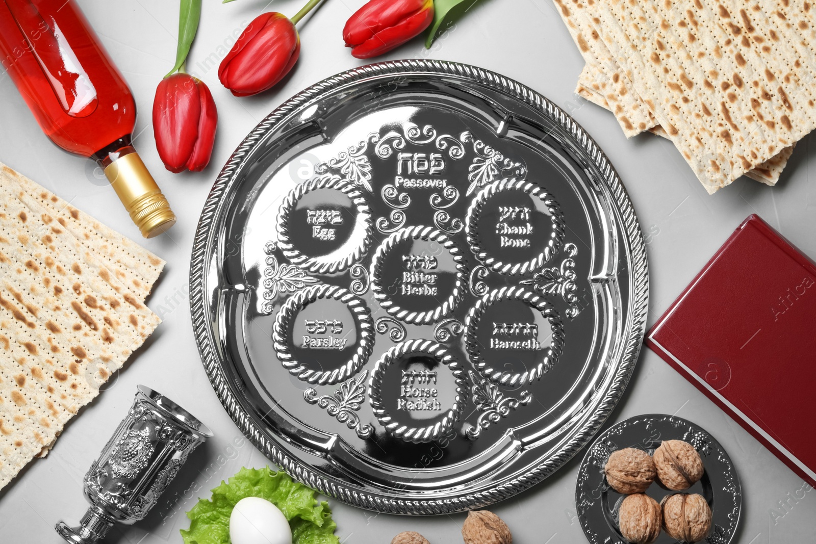 Photo of Flat lay composition with symbolic Passover (Pesach) items on color background