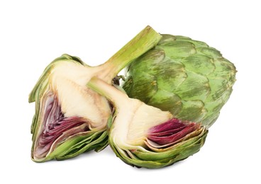 Photo of Cut and whole fresh artichokes on white background