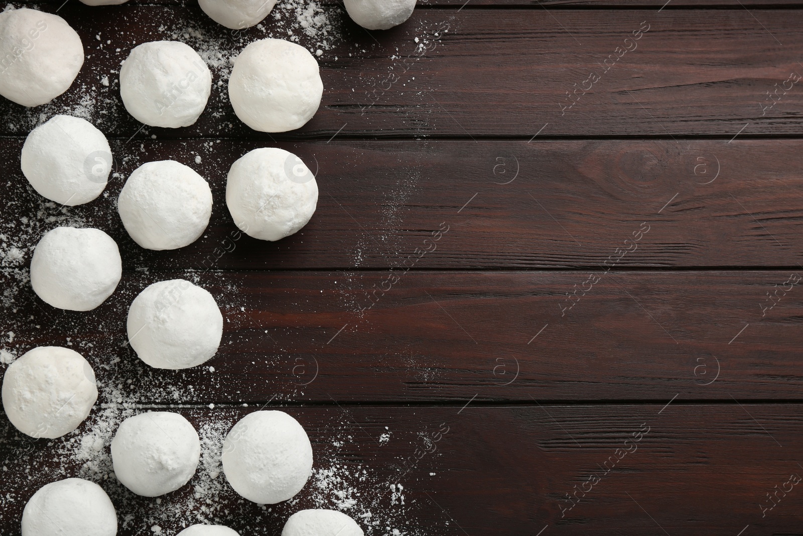 Photo of Snowballs on wooden background, flat lay. Space for text