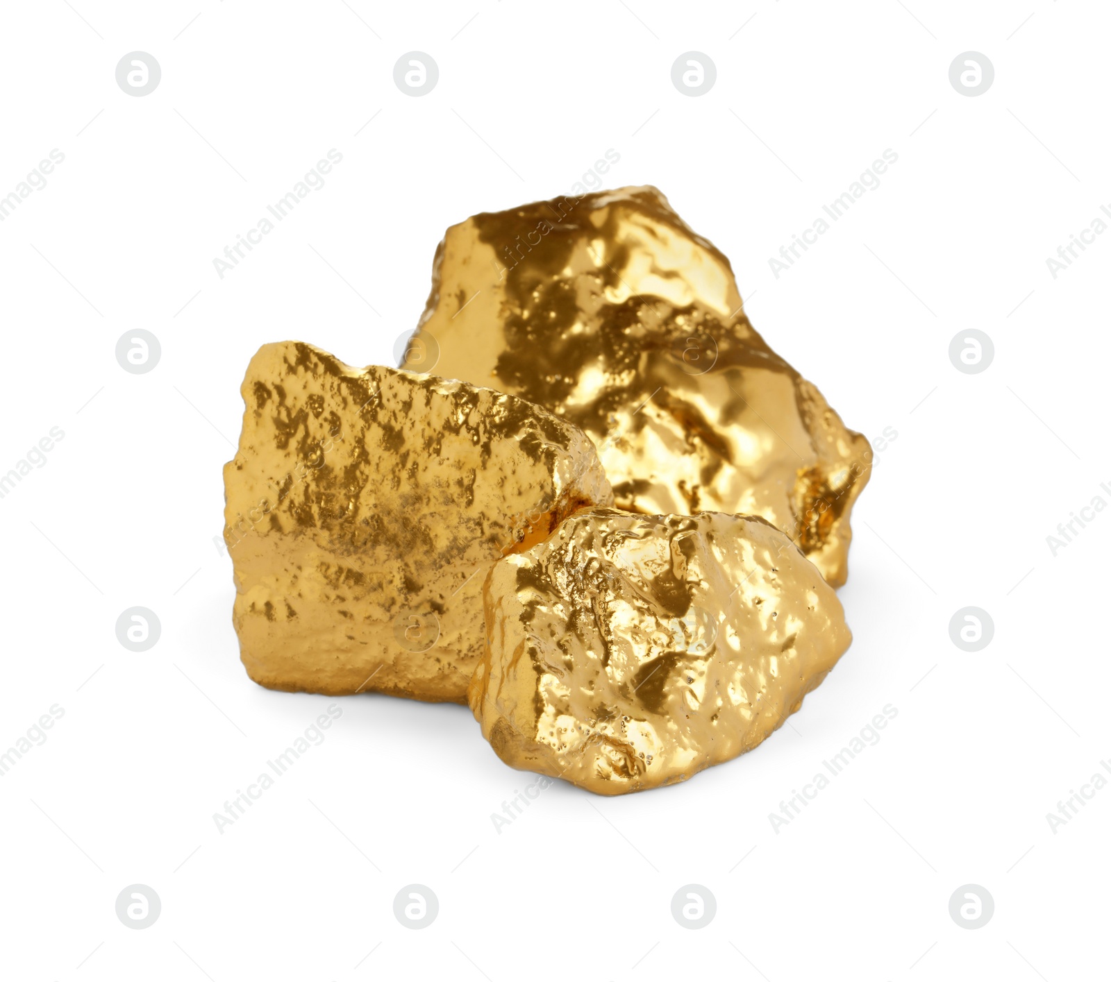 Photo of Three shiny gold nuggets on white background