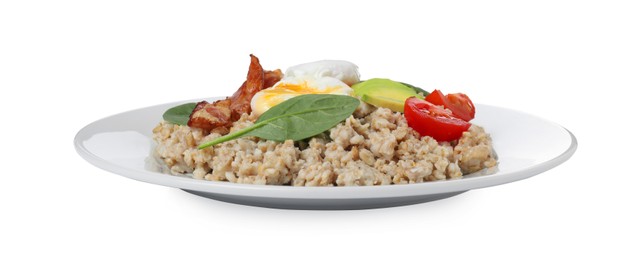 Photo of Delicious boiled oatmeal with poached egg, bacon, avocado and tomato isolated on white