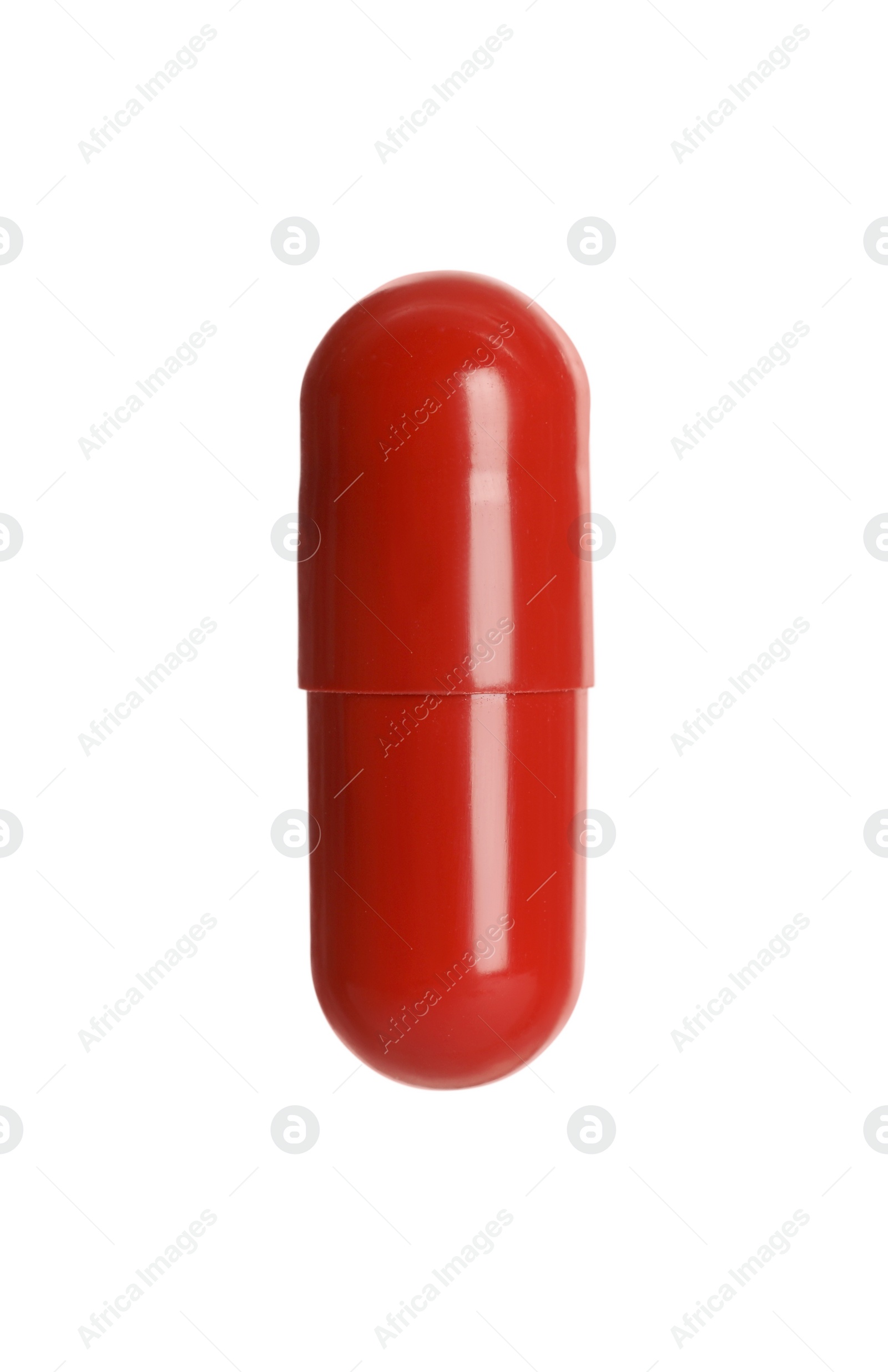 Photo of One red pill on white background. Medicinal treatment