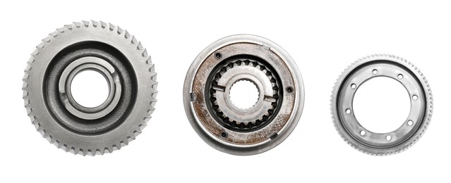 Image of Set with different stainless steel gears on white background, top view. Banner design