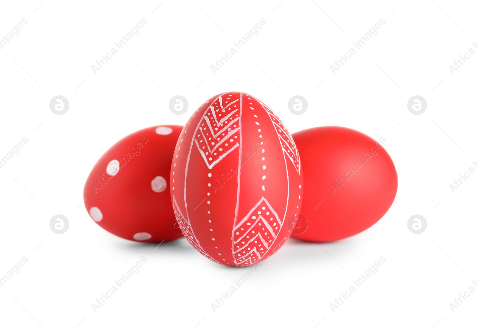 Photo of Creative painted red Easter eggs on white background