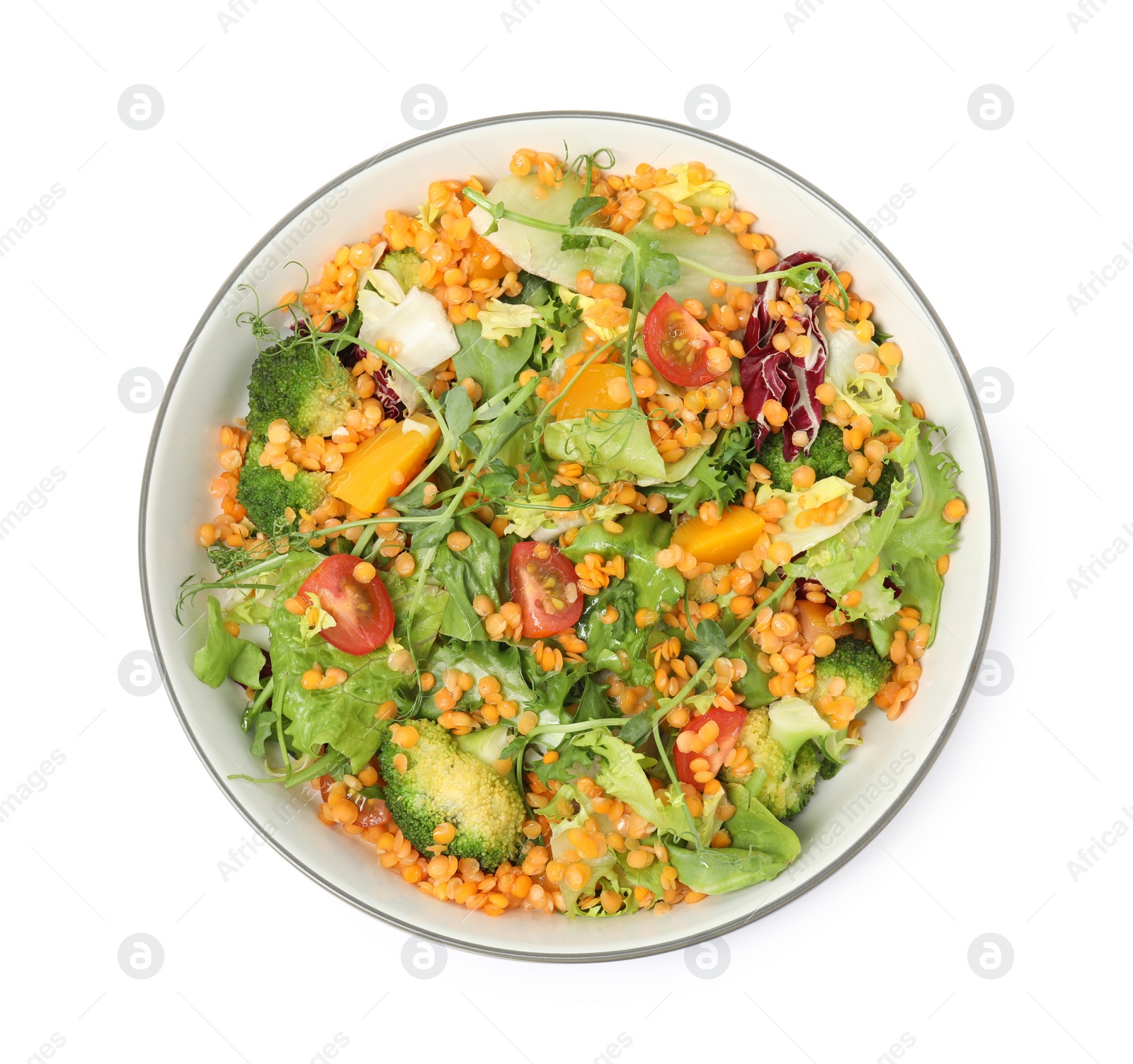 Photo of Bowl of delicious salad with lentils and vegetables isolated on white, top view