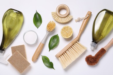 Flat lay composition with different cleaning supplies on white background