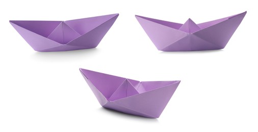 Image of Set with violet paper boats on white background