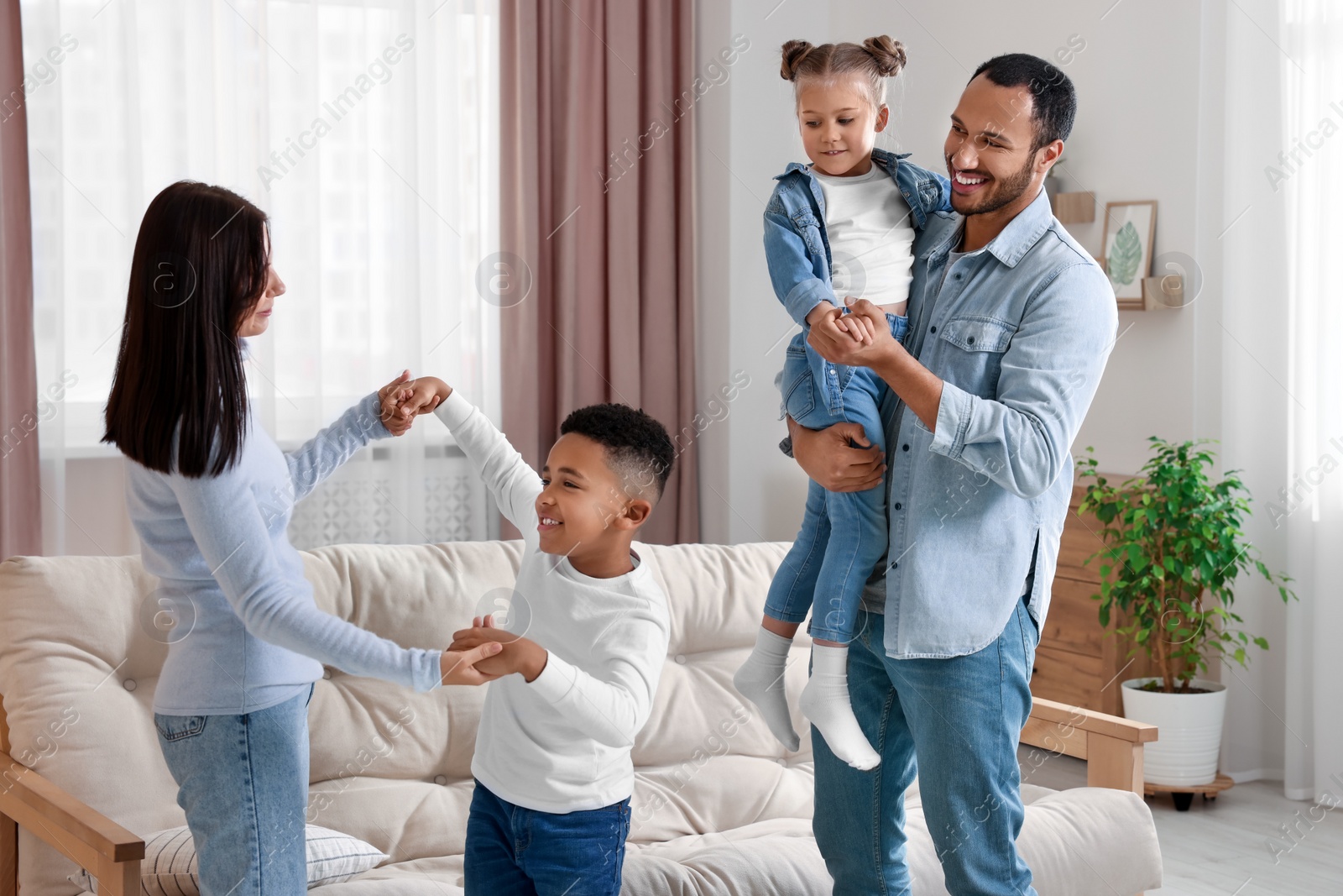 Photo of Happy international family spending time together at home