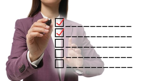 Image of To Do List. Woman ticking check boxes with marker on virtual screen against white background, closeup