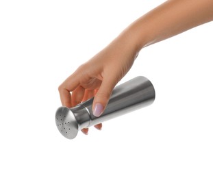 Photo of Woman holding stainless salt or pepper shaker on white background, closeup