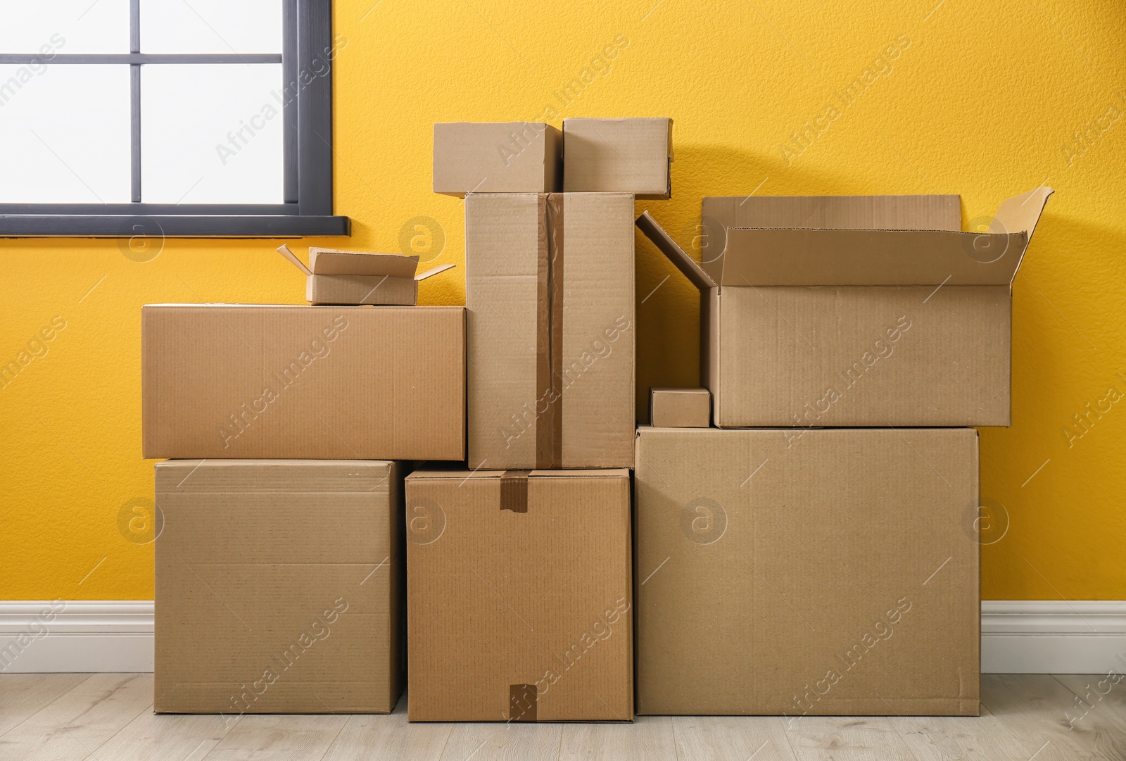 Photo of Cardboard boxes on floor indoors