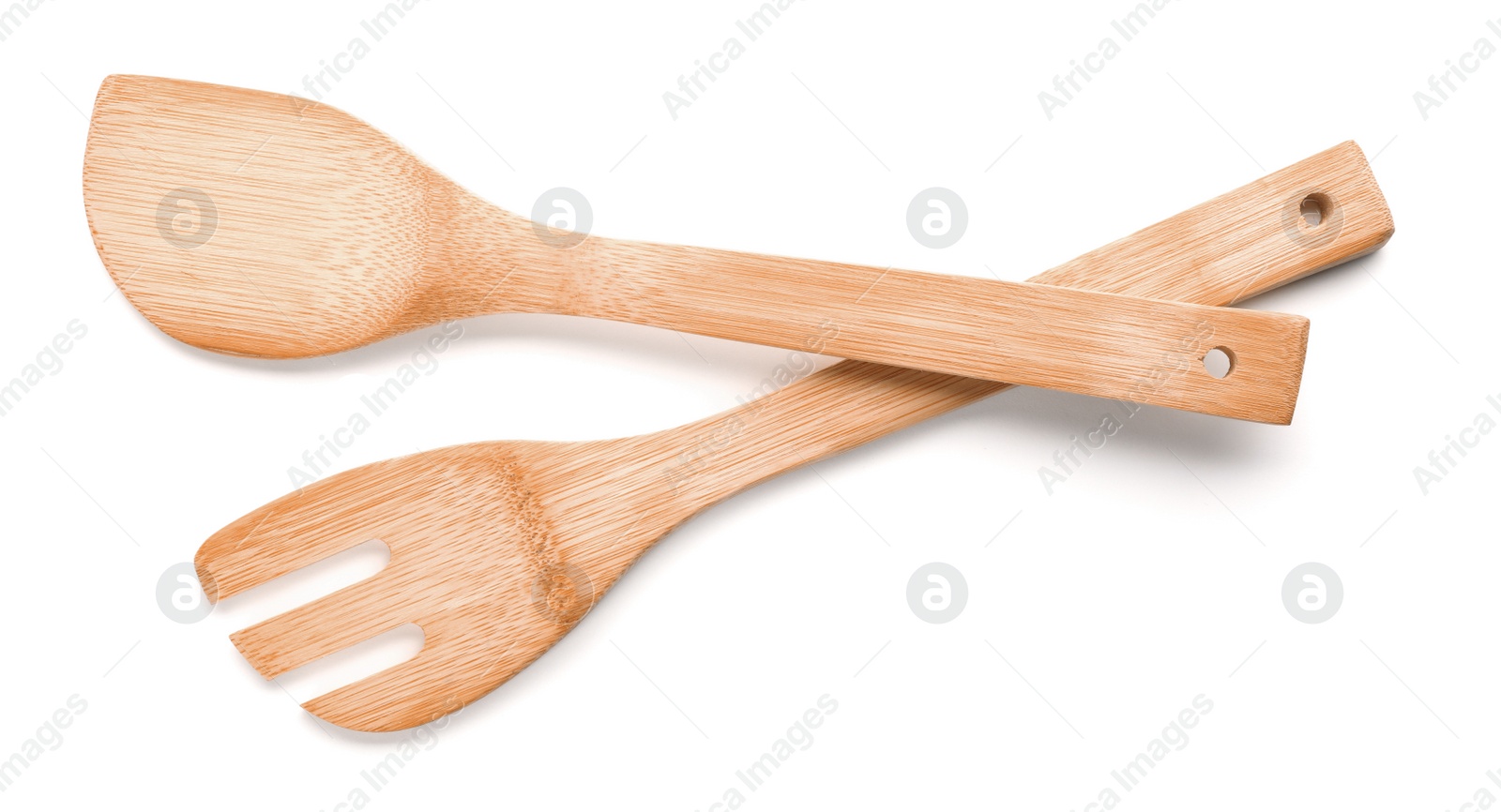 Photo of Kitchen utensils made of bamboo on white background, top view