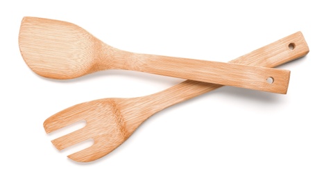 Kitchen utensils made of bamboo on white background, top view