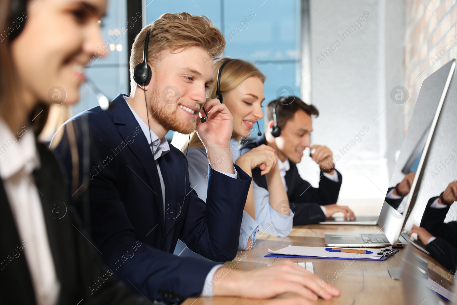 Photo of Technical support team working in modern office