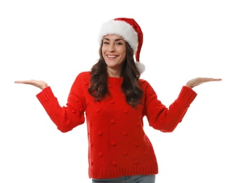 Photo of Young woman in Christmas sweater and hat on white background