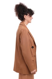 Photo of Young businesswoman in suit standing on white background