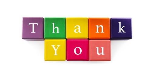 Photo of Phrase Thank You made of colorful cubes on white background, top view