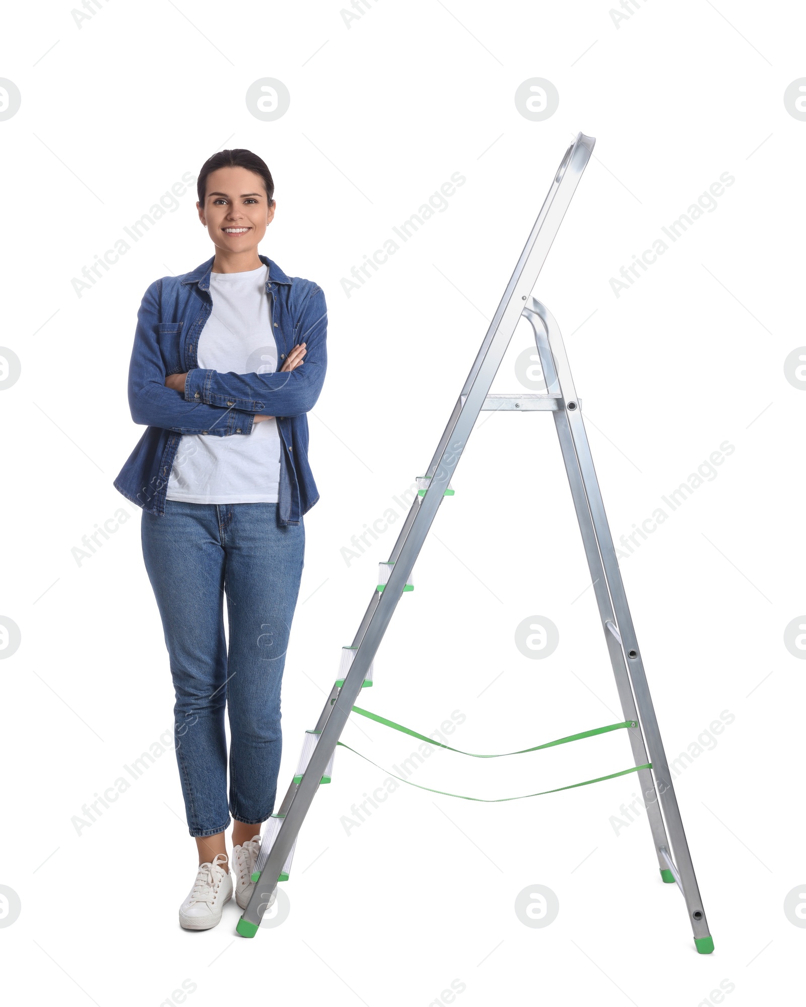 Photo of Young woman near metal ladder on white background