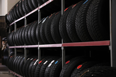 Photo of Car tires on rack in auto store