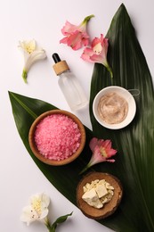 Photo of Flat lay composition with different spa products and beautiful flowers on white table