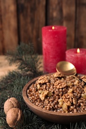 Traditional Christmas slavic dish kutia in bowl, closeup. Space for text