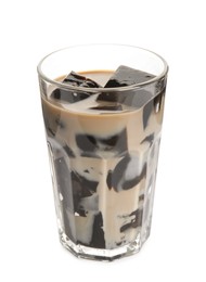 Photo of Glass of milk with grass jelly isolated on white